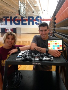 Mann and Horner shown with heart rate monitors and iPad displaying a view of the results within the software.